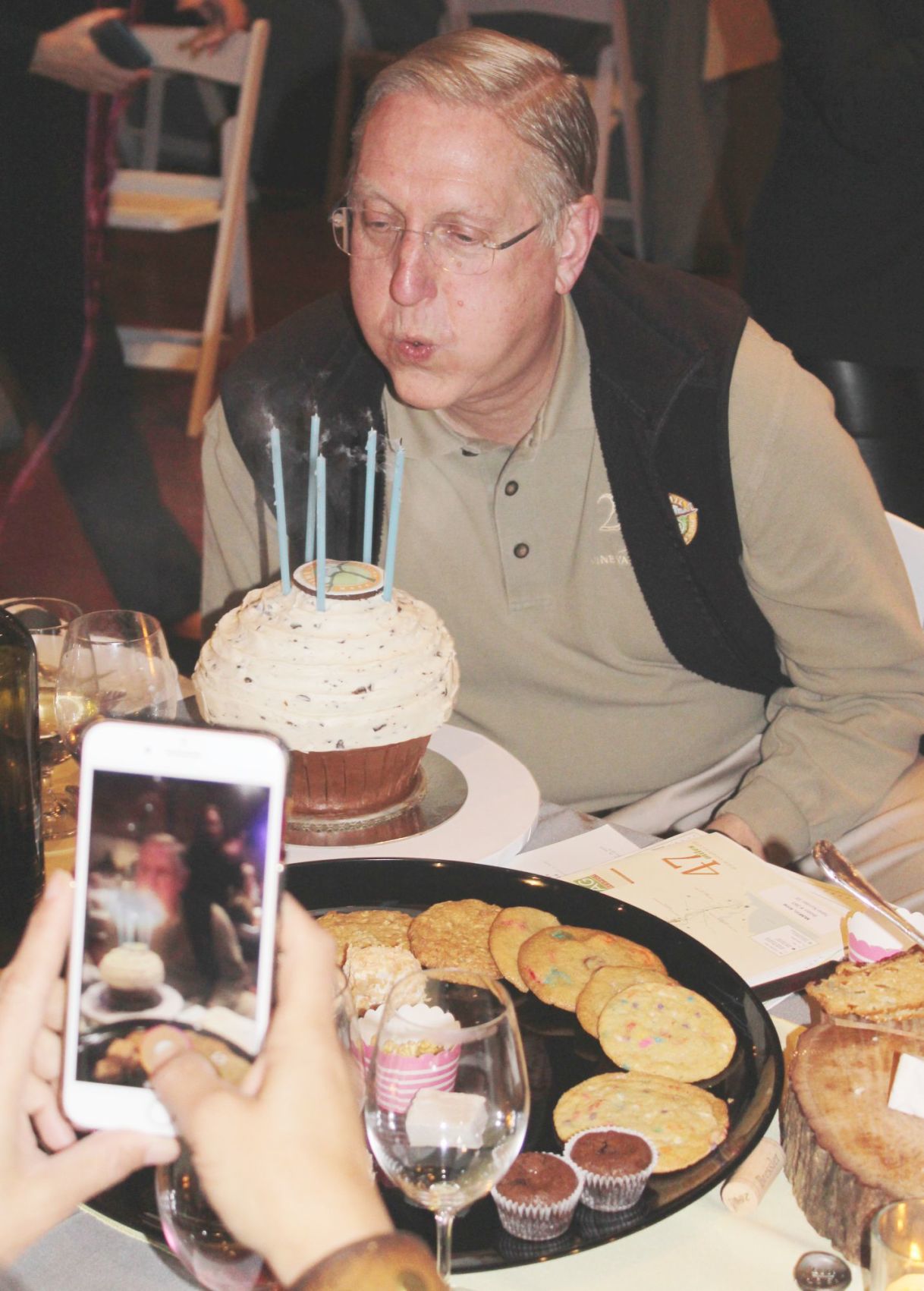 Chuck McMinn blows out his birthday candles